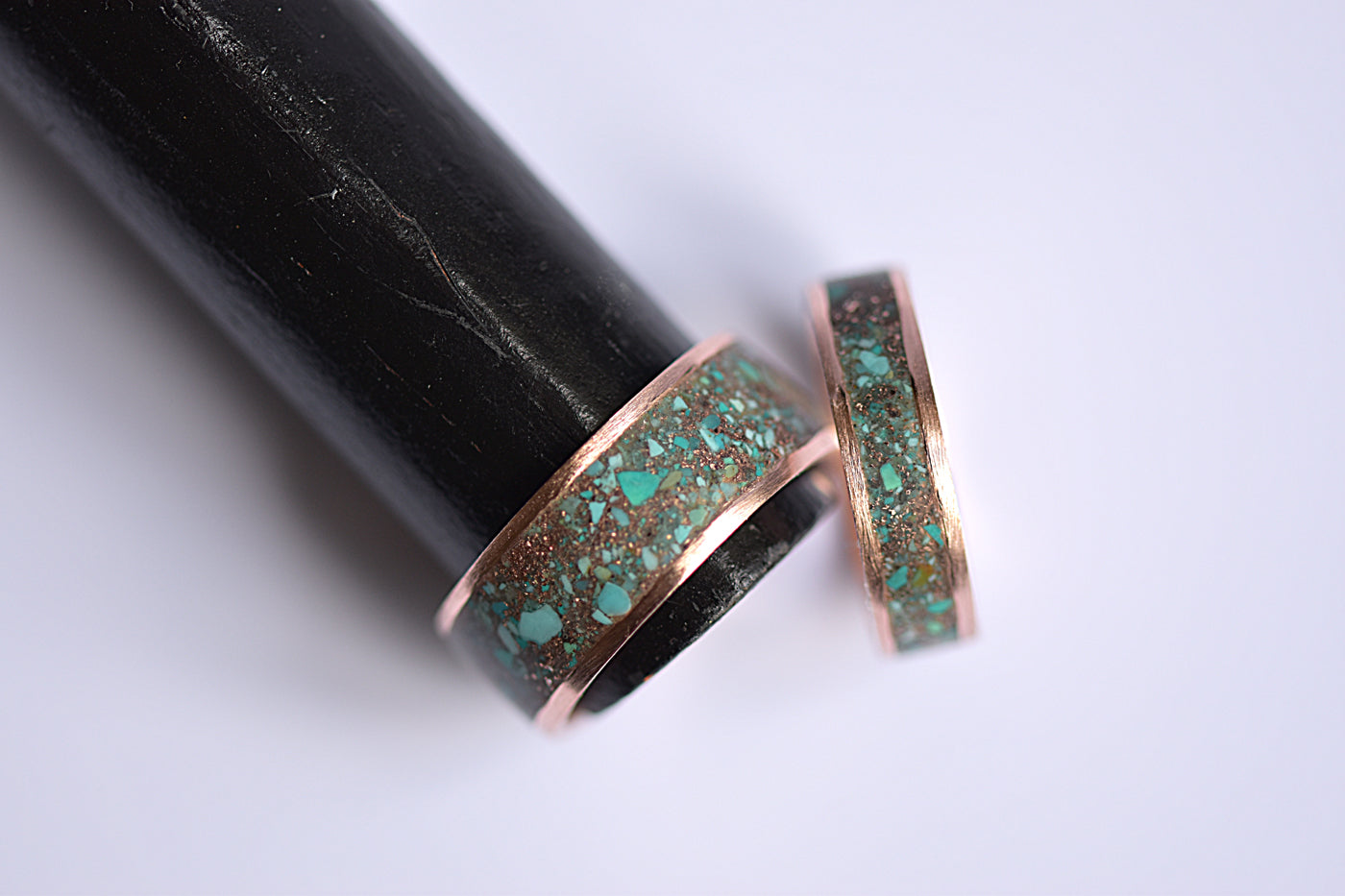 Matching Gold Inlay Wedding Bands on Ring Display