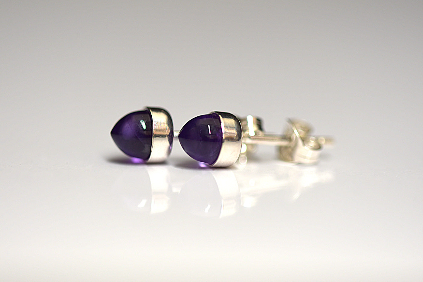 Purple Amethyst Bullet Studs White Background
