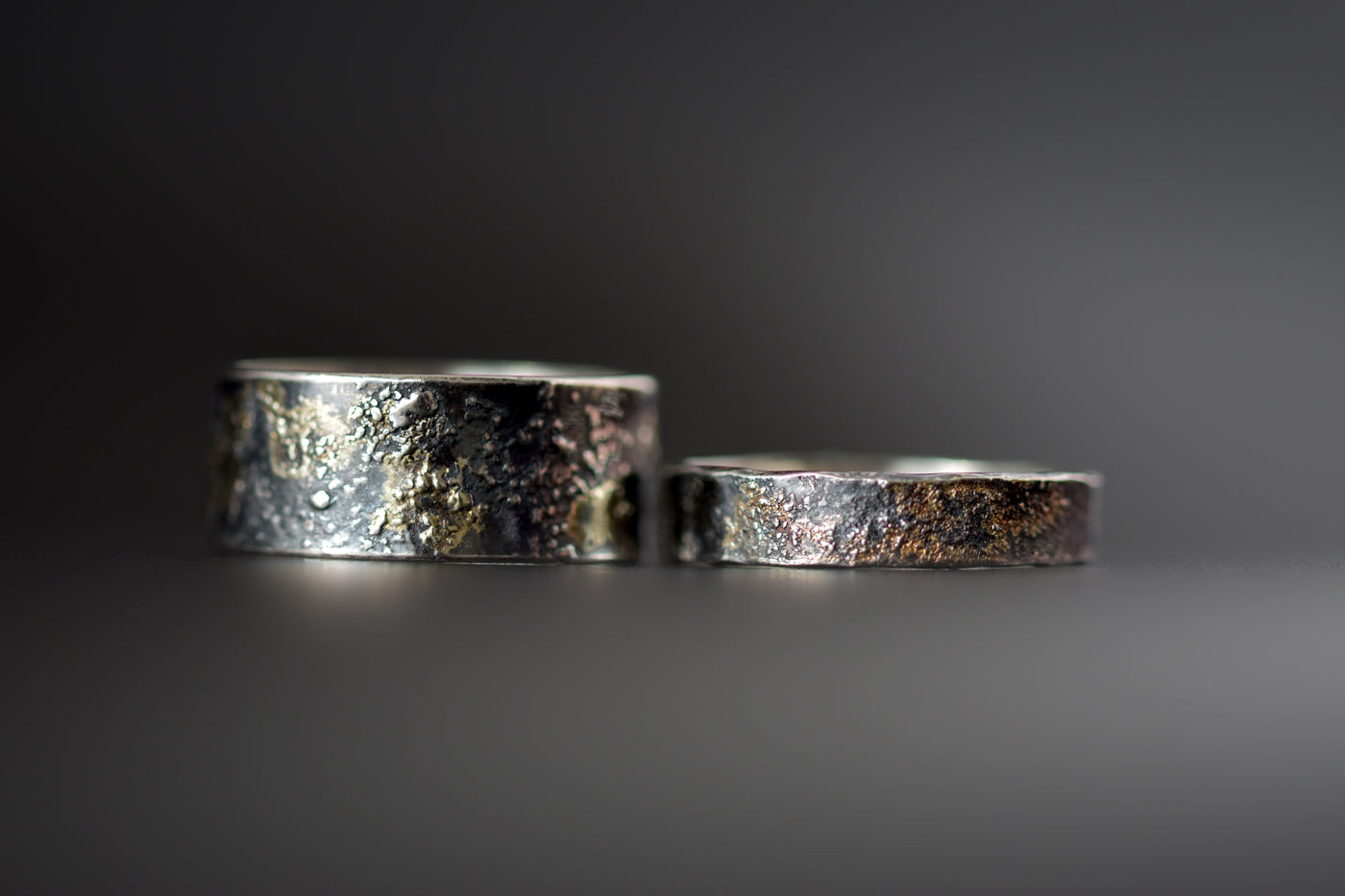 Molten 18ct Gold and Sterling Silver Rings Black Background