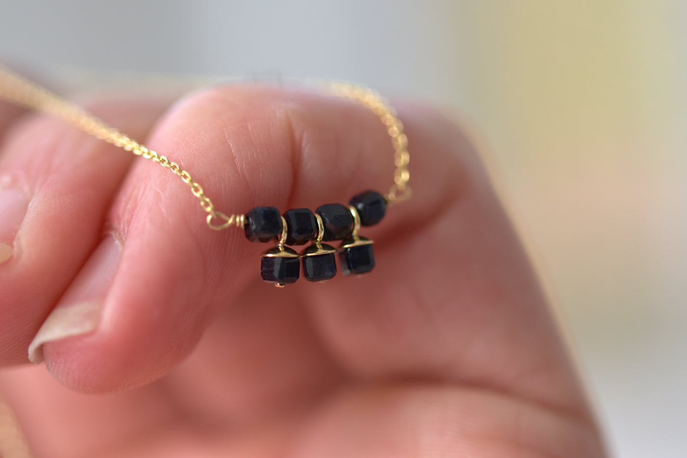 9ct Gold Sapphire Cube Necklace on Hand