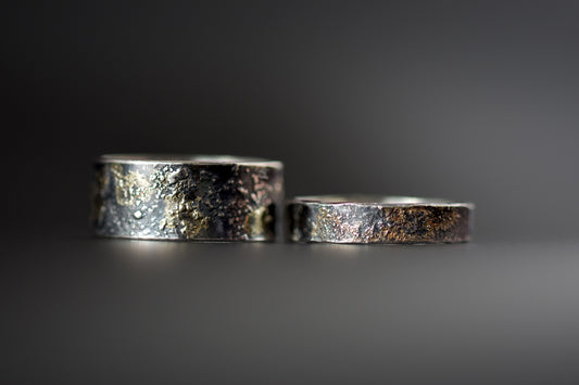 Molten 18ct Gold and Sterling Silver Rings Black Background