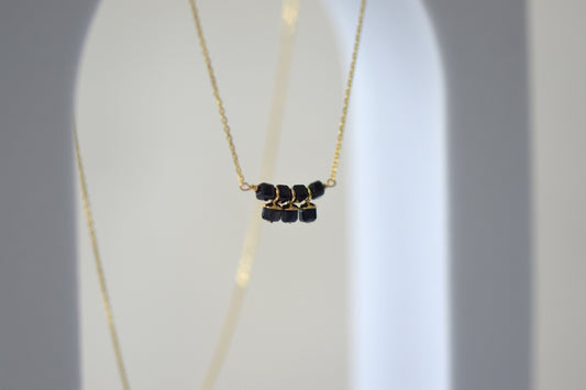 9ct Gold Sapphire Cube Necklace on Display